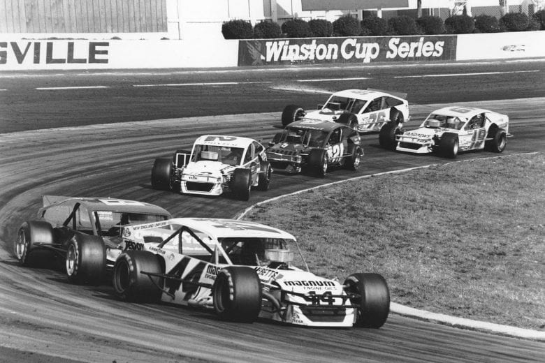 MARTINSVILLE, VA - MARCH 11, 1990:  Reggie Ruggerio (No. 44) heads the field on his way to winning the NASCAR Modified Miller Classic at Martinsville Speedway. Ruggerio leads Jeff Fuller (No. 8), Jamie Tomaino (No. U2), George Kent (No. 21), Bob Park (No. 19) and Tom Bolles (No. 76). (Photo by ISC Images & Archives via Getty Images)