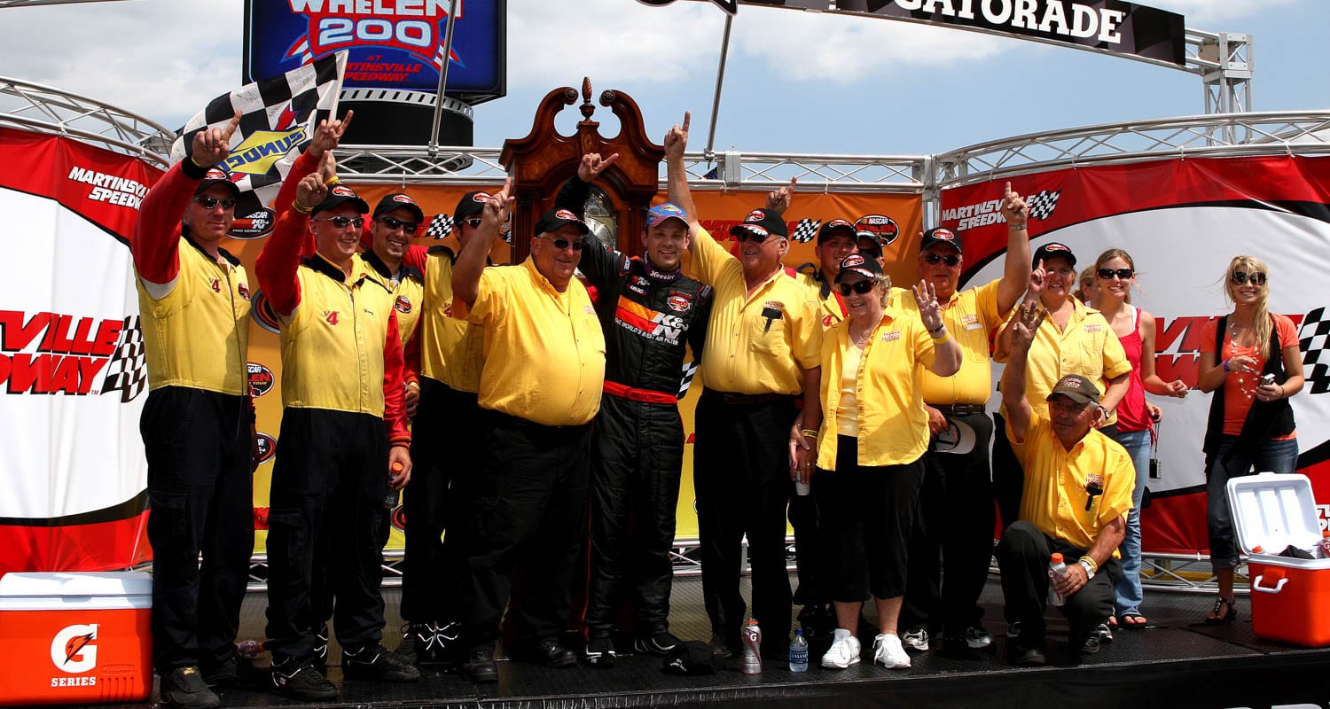 MARTINSVILLE, VA - JUNE 06: Bobby Santos, driver of the #4 "Mystic Missile" Dodge, and his team celebrate in victory lane after winning the NASCAR Whelen Modified Tour Made in America Whelen 200 at Martinsville Speedway on June 6, 2010 in Martinsville, Virginia.(Tom Whitmore/Getty Images for NASCAR) | Getty Images
