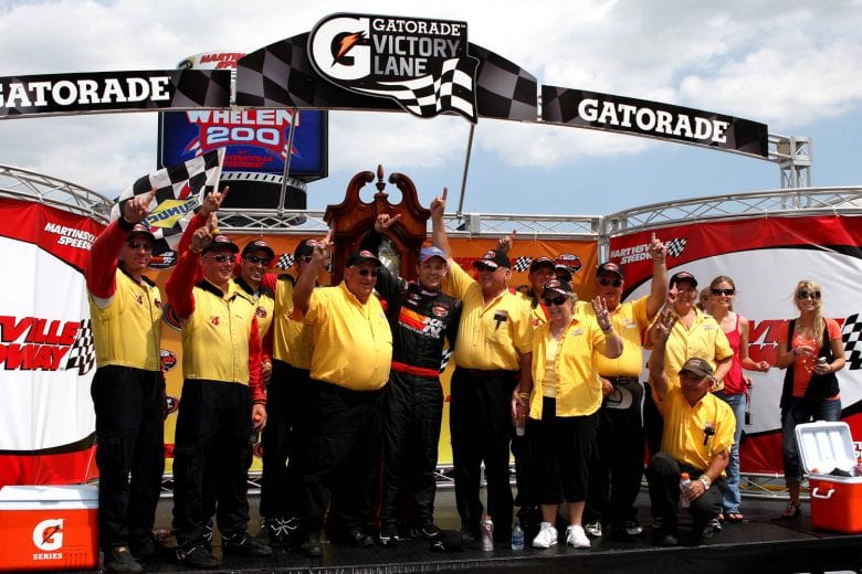MARTINSVILLE, VA - JUNE 06: Bobby Santos, driver of the #4 Mystic Missile Dodge, and his team celebrate in victory lane after winning the NASCAR Whelen Modified Tour Made in America Whelen 200 at Martinsville Speedway on June 6, 2010 in Martinsville, Virginia.(Tom Whitmore/Getty Images for NASCAR) | Getty Images