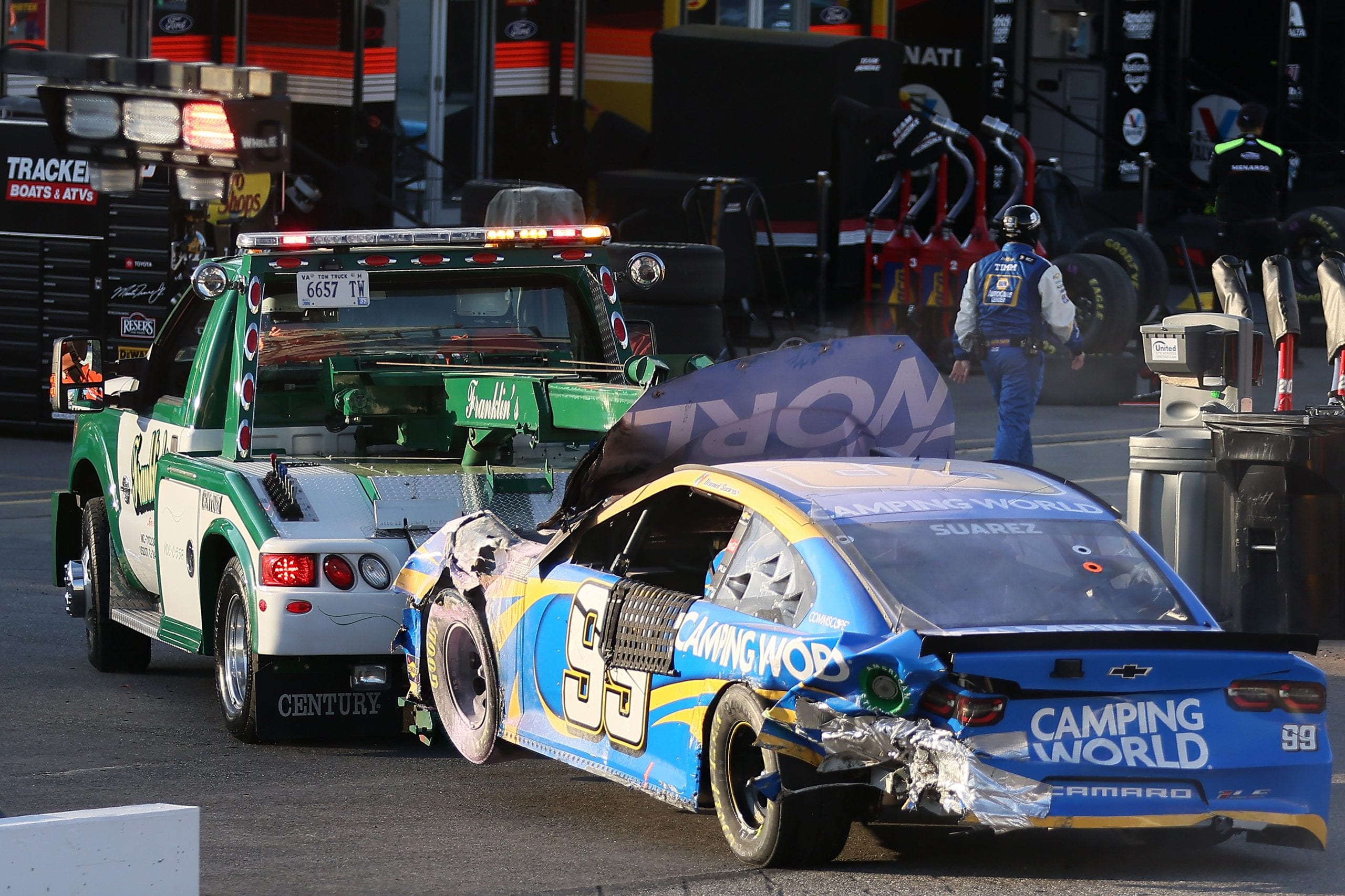 MARTINSVILLE, VIRGINIA - APRIL 11: The #99 Camping World Chevrolet, driven by Daniel Suarez is towed off the track after an on-track incident during the NASCAR Cup Series Blue-Emu Maximum Pain Relief 500 at Martinsville Speedway on April 11, 2021 in Martinsville, Virginia. (Photo by James Gilbert/Getty Images) | Getty Images