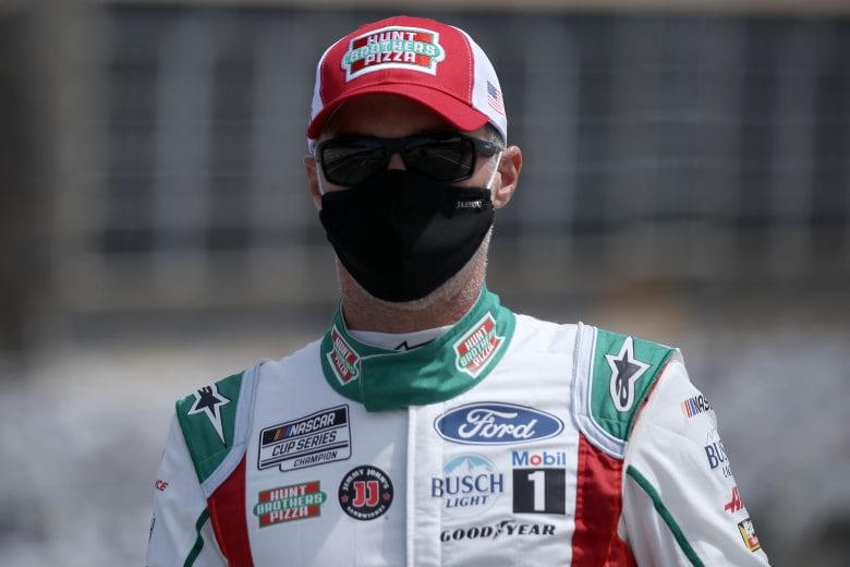 HAMPTON, GEORGIA - MARCH 21: Kevin Harvick, driver of the #4 Hunt Brothers Pizza Ford, walks the grid prior to  the NASCAR Cup Series Folds of Honor QuikTrip 500 at Atlanta Motor Speedway on March 21, 2021 in Hampton, Georgia. (Photo by Sean Gardner/Getty Images) | Getty Images