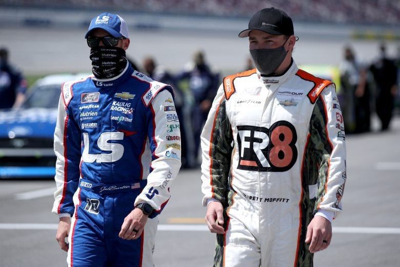 TALLADEGA, ALABAMA - APRIL 24: Brett Moffitt, driver of the #02 Fr8 Auctions Chevrolet, and Jeb Burton, driver of the #10 LS Tractors Chevrolet, walk the grid prior to the NASCAR Xfinity Series Ag-Pro 300 at Talladega Superspeedway on April 24, 2021 in Talladega, Alabama. (Photo by Sean Gardner/Getty Images) | Getty Images