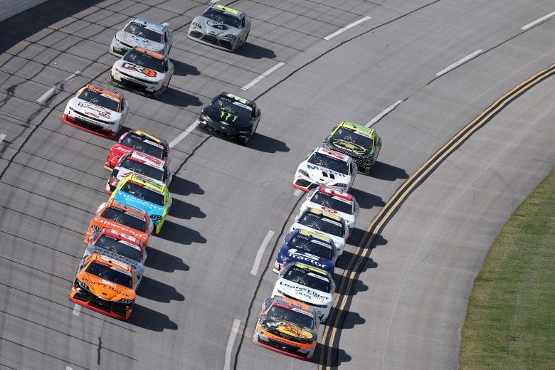 TALLADEGA, ALABAMA - APRIL 24: Noah Gragson, driver of the #9 Bass Pro Shops/True Timber/BRCC Chevrolet, and Daniel Hemric, driver of the #18 Poppy Bank Toyota, lead the field during the NASCAR Xfinity Series Ag-Pro 300 at Talladega Superspeedway on April 24, 2021 in Talladega, Alabama. (Photo by James Gilbert/Getty Images) | Getty Images