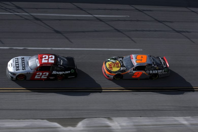 TALLADEGA, ALABAMA - APRIL 24: Austin Cindric, driver of the #22 Snap-On Ford, and Noah Gragson, driver of the #9 Bass Pro Shops/True Timber/BRCC Chevrolet, race during the NASCAR Xfinity Series Ag-Pro 300 at Talladega Superspeedway on April 24, 2021 in Talladega, Alabama. (Photo by Sean Gardner/Getty Images) | Getty Images