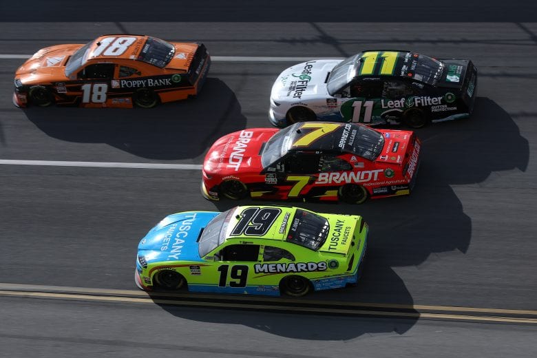 TALLADEGA, ALABAMA - APRIL 24: Daniel Hemric, driver of the #18 Poppy Bank Toyota, Brandon Jones, driver of the #19 Menards/Tuscany Faucets Toyota, Justin Allgaier, driver of the #7 BRANDT Chevrolet, and Justin Haley, driver of the #11 LeafFilter Gutter Protection Chevrolet, race during the NASCAR Xfinity Series Ag-Pro 300 at Talladega Superspeedway on April 24, 2021 in Talladega, Alabama. (Photo by Sean Gardner/Getty Images) | Getty Images