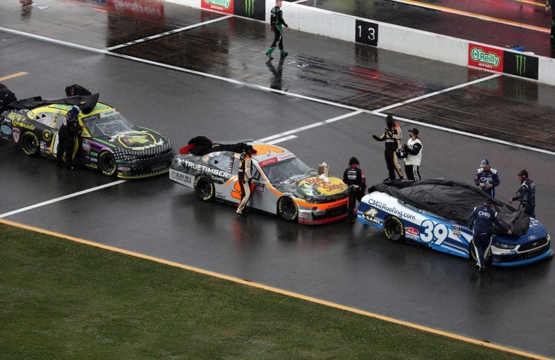 TALLADEGA, ALABAMA - APRIL 24: Cars park on the grid during a rain delay of the NASCAR Xfinity Series Ag-Pro 300 at Talladega Superspeedway on April 24, 2021 in Talladega, Alabama. (Photo by James Gilbert/Getty Images) | Getty Images