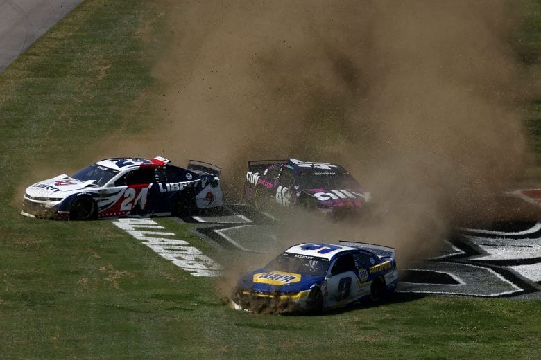 TALLADEGA, ALABAMA - APRIL 25: Chase Elliott, driver of the #9 NAPA Auto Parts Chevrolet, Alex Bowman, driver of the #48 Ally Chevrolet, and William Byron, driver of the #24 Liberty University Chevrolet, spin into the infield grass during the NASCAR Cup Series GEICO 500 at Talladega Superspeedway on April 25, 2021 in Talladega, Alabama. (Photo by James Gilbert/Getty Images) | Getty Images