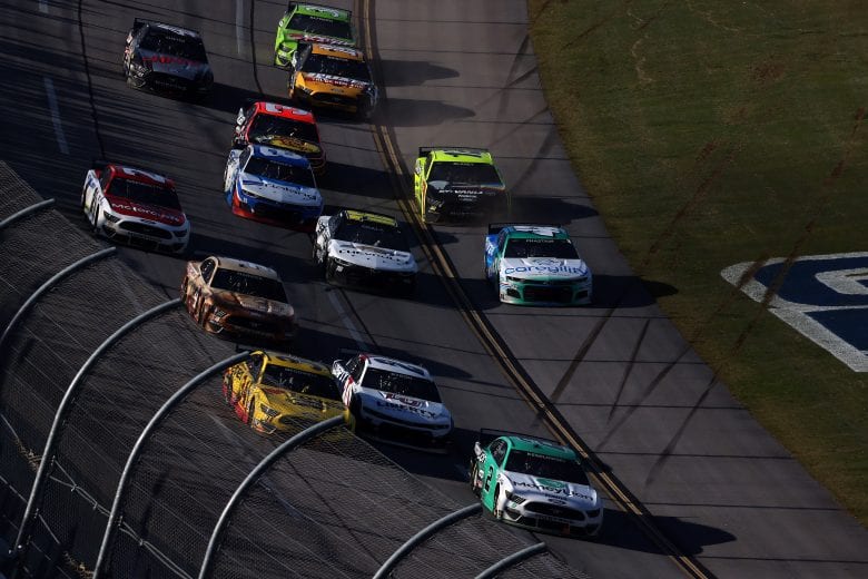 TALLADEGA, ALABAMA - APRIL 25: Brad Keselowski, driver of the #2 MoneyLion Ford, leads Michael McDowell, driver of the #34 Love's Travel Stops Ford, and William Byron, driver of the #24 Liberty University Chevrolet, on the final lao of the NASCAR Cup Series GEICO 500 at Talladega Superspeedway on April 25, 2021 in Talladega, Alabama. (Photo by James Gilbert/Getty Images) | Getty Images