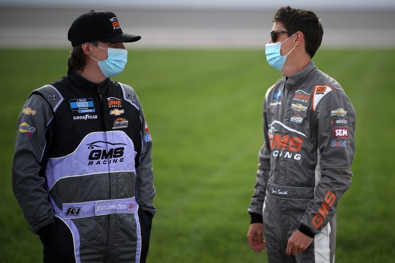 KANSAS CITY, KANSAS - MAY 01: Sheldon Creed, driver of the #2 Chevrolet, and Zane Smith, driver of the #21 Chevrolet, talk on the grid prior to the NASCAR Camping World Truck Series Wise Power 200 at Kansas Speedway on May 01, 2021 in Kansas City, Kansas. (Photo by Sean Gardner/Getty Images) | Getty Images