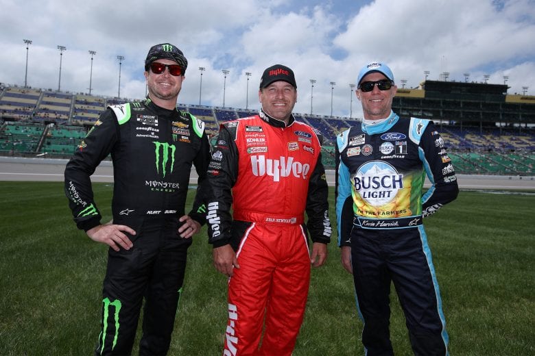 KANSAS CITY, KANSAS - MAY 02: Kurt Busch, driver of the #1 Monster Energy Chevrolet, Ryan Newman, driver of the #6 Hy-Vee Ford, and Kevin Harvick, driver of the #4 Busch Light For The Farmers Ford, pose for photos prior to the NASCAR Cup Series Buschy McBusch Race 400 at Kansas Speedway on May 02, 2021 in Kansas City, Kansas. (Photo by Sean Gardner/Getty Images) | Getty Images