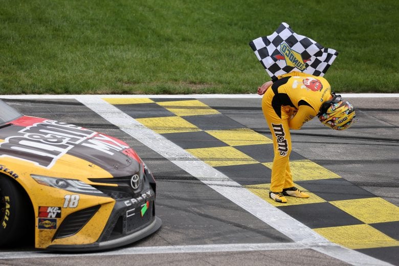 KANSAS CITY, KANSAS - MAY 02: Kyle Busch, driver of the #18 M&M's Mix Toyota, takes a bow after winning the NASCAR Cup Series Buschy McBusch Race 400 at Kansas Speedway on May 02, 2021 in Kansas City, Kansas. (Photo by James Gilbert/Getty Images) | Getty Images