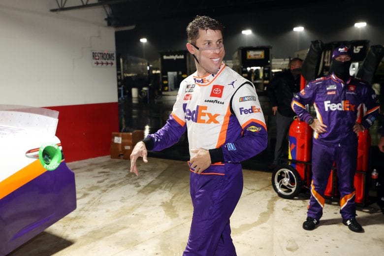 DARLINGTON, SOUTH CAROLINA - MAY 20: Denny Hamlin, driver of the #11 FedEx Delivering Strength Toyota, celebrates in Victory Lane after winning the rain-shortened NASCAR Cup Series Toyota 500 at Darlington Raceway on May 20, 2020 in Darlington, South Carolina. (Photo by Chris Graythen/Getty Images) | Getty Images