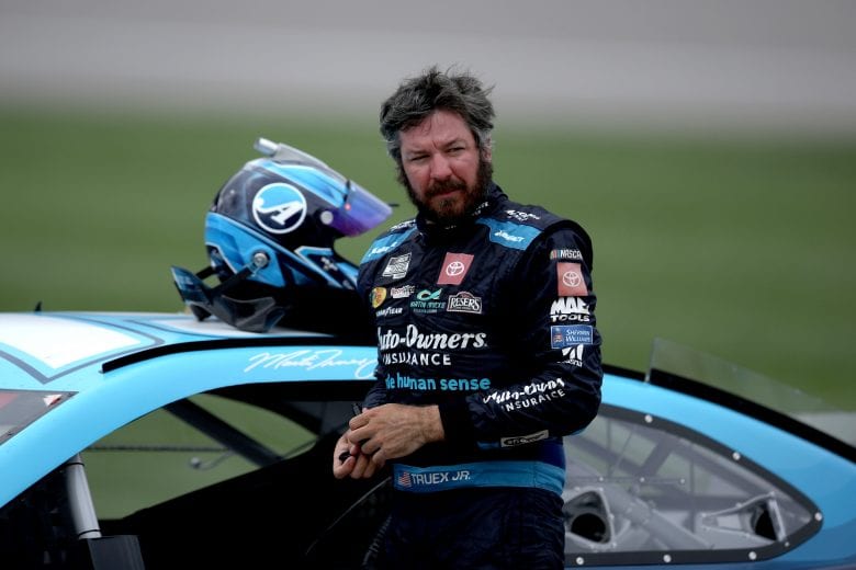 KANSAS CITY, KANSAS - MAY 02: Martin Truex Jr., driver of the #19 Auto-Owners Insurance Toyota, exits his car after winning the NASCAR Cup Series Buschy McBusch Race 400 at Kansas Speedway on May 02, 2021 in Kansas City, Kansas. (Photo by Sean Gardner/Getty Images) | Getty Images