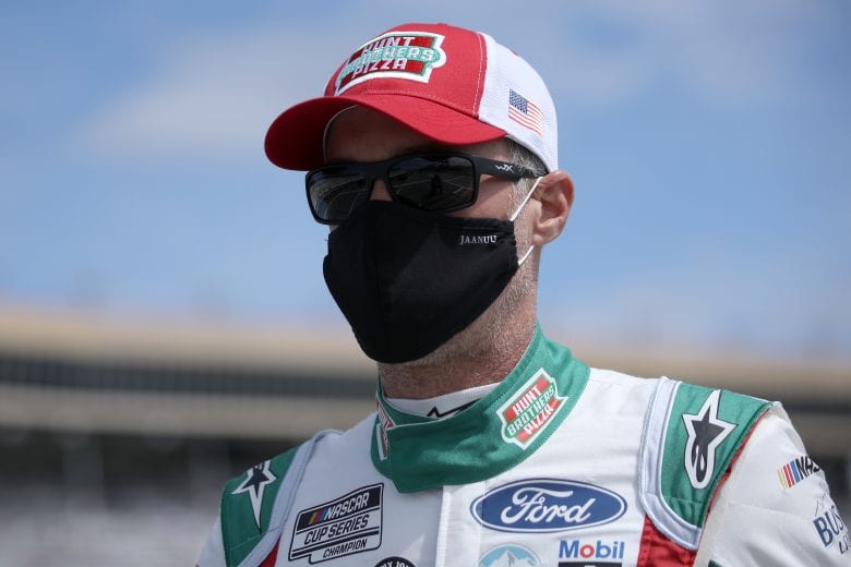 HAMPTON, GEORGIA - MARCH 21: Kevin Harvick, driver of the #4 Hunt Brothers Pizza Ford, walks the grid prior to the NASCAR Cup Series Folds of Honor QuikTrip 500 at Atlanta Motor Speedway on March 21, 2021 in Hampton, Georgia. (Photo by Sean Gardner/Getty Images) | Getty Images
