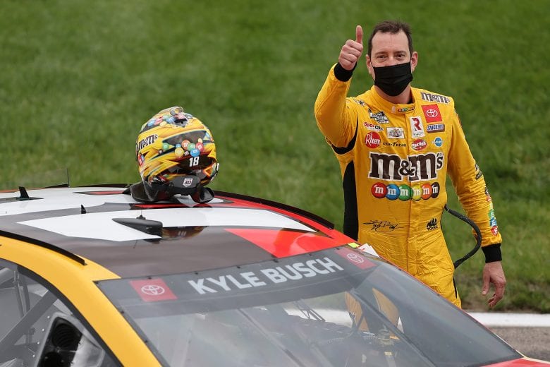 KANSAS CITY, KANSAS - MAY 02: Kyle Busch, driver of the #18 M&M's Mix Toyota, gives a thumbs up after winning the NASCAR Cup Series Buschy McBusch Race 400 at Kansas Speedway on May 02, 2021 in Kansas City, Kansas. (Photo by James Gilbert/Getty Images) | Getty Images
