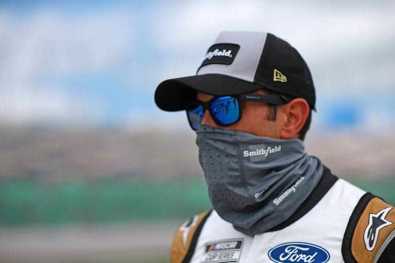 KANSAS CITY, KANSAS - MAY 02: Aric Almirola, driver of the #10 Smithfield/Price Chopper Ford, walks the grid prior to the NASCAR Cup Series Buschy McBusch Race 400 at Kansas Speedway on May 02, 2021 in Kansas City, Kansas. (Photo by Sean Gardner/Getty Images) | Getty Images