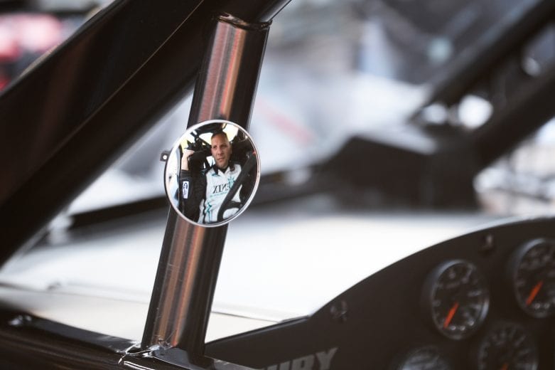 Justin Bonsignore, driver of #51 Phoenix Communications Inc. Chevrolet reflects in his mirror during the Miller Lite 200 for the NASCAR Whelen Modified Tour at Riverhead Raceway in Riverhead, New York on May 15, 2021. (Kathryn Riley/NASCAR)