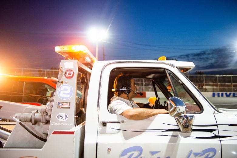 A tow truck driver is on standby during the Miller Lite 200 for the NASCAR Whelen Modified Tour at Riverhead Raceway in Riverhead, New York on May 15, 2021. (Kathryn Riley/NASCAR)