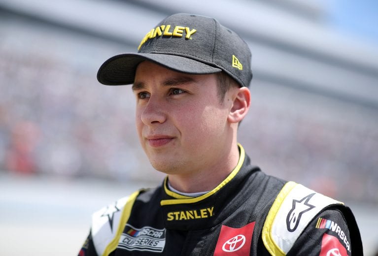 DOVER, DELAWARE - MAY 16: Christopher Bell, driver of the #20 STANLEY Toyota, walks the grid during the NASCAR Cup Series Drydene 400 at Dover International Speedway on May 16, 2021 in Dover, Delaware. (Photo by Sean Gardner/Getty Images) | Getty Images