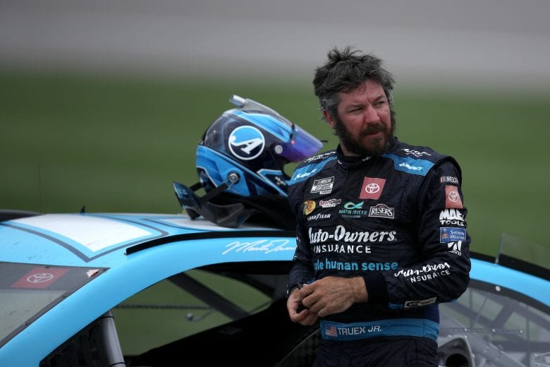 KANSAS CITY, KANSAS - MAY 02: Martin Truex Jr., driver of the #19 Auto-Owners Insurance Toyota, exits his car after winning the NASCAR Cup Series Buschy McBusch Race 400 at Kansas Speedway on May 02, 2021 in Kansas City, Kansas. (Photo by Sean Gardner/Getty Images) | Getty Images