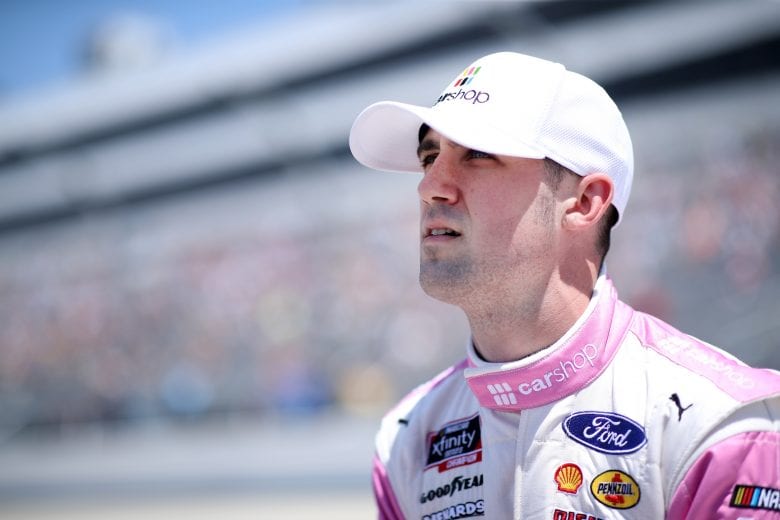 DOVER, DELAWARE - MAY 15: Austin Cindric, driver of the #22 Car Shop Ford, walks the grid during the NASCAR Xfinity Series Drydene 200 race at Dover International Speedway on May 15, 2021 in Dover, Delaware. (Photo by Sean Gardner/Getty Images) | Getty Images