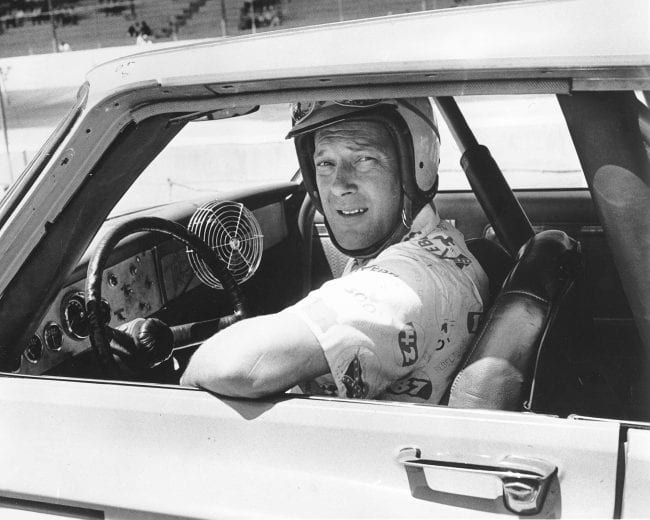1964:  Driver Jim Paschal shows his unique way to cool off during a NASCAR Cup race. Paschal won the World 600 at Charlotte Motor Speedway during the year driving for Petty Enterprises. (Photo by ISC Images & Archives via Getty Images)