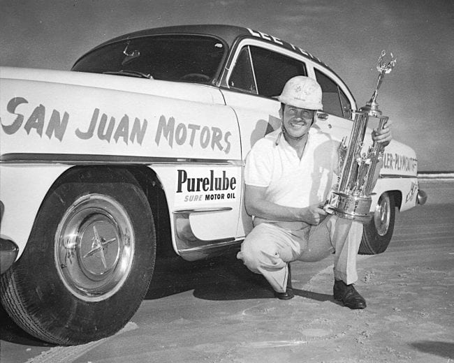 WEST PALM BEACH, FL - FEBRUARY 7, 1954:  Lee Petty #42 poses with his car and trophy after winning the race at the Palm Beach Speedway in his Dodge, just as he did a year earlier when he won this event.  (Photo by ISC Archives/CQ-Roll Call Group via Getty Images)
