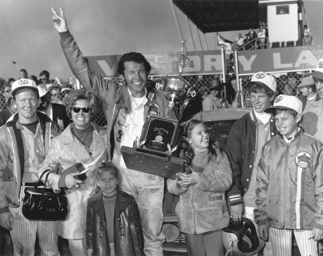 DAYTONA BEACH, FL - FEBRUARY 14, 1971:  Daytona 500 winner Richard Petty with his wife Lynda, his nephew Randy Owens (second from right) and other family members.  (Photo by ISC Archives/CQ-Roll Call Group via Getty Images)