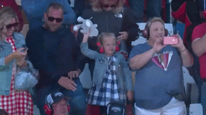 Kid Waving Stuffed Animal