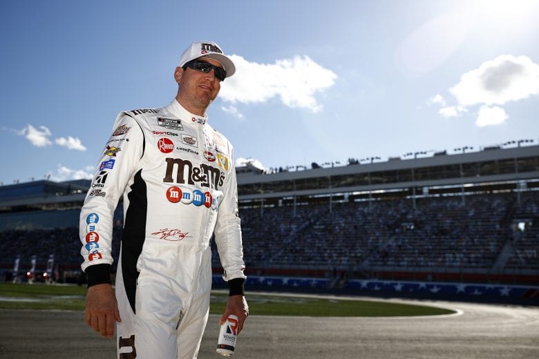 CONCORD, NORTH CAROLINA - MAY 30: Kyle Busch, driver of the #18 M&M's Red White & Blue Toyota, walks the grid prior to the NASCAR Cup Series Coca-Cola 600 at Charlotte Motor Speedway on May 30, 2021 in Concord, North Carolina. (Photo by Jared C. Tilton/Getty Images) | Getty Images