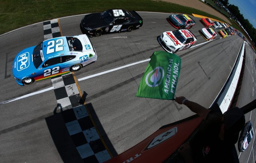 LEXINGTON, OHIO - JUNE 05: Austin Cindric, driver of the #22 PPG Ford, leads Ty Gibbs, driver of the #54 Joe Gibbs Racing Toyota, and Harrison Burton, driver of the #20 DEX Imaging Toyota, to the green flag to start the NASCAR Xfinity Series B&L Transport 170 at Mid-Ohio Sports Car Course on June 05, 2021 in Lexington, Ohio. (Photo by Sean Gardner/Getty Images) | Getty Images