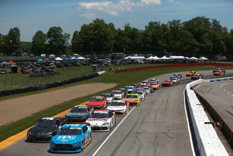 LEXINGTON, OHIO - JUNE 05: Austin Cindric, driver of the #22 PPG Ford, leads Ty Gibbs, driver of the #54 Joe Gibbs Racing Toyota, and Harrison Burton, driver of the #20 DEX Imaging Toyota, on an early restart during the NASCAR Xfinity Series B&L Transport 170 at Mid-Ohio Sports Car Course on June 05, 2021 in Lexington, Ohio. (Photo by Sean Gardner/Getty Images) | Getty Images