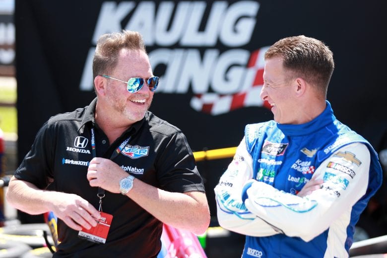 LEXINGTON, OHIO - JUNE 05: : IndyCar team owner Michael Shank (L) and AJ Allmendinger, driver of the #16 RAMCO Specialties Inc Chevrolet, talk on the grid prior to the NASCAR Xfinity Series B&L Transport 170 at Mid-Ohio Sports Car Course on June 05, 2021 in Lexington, Ohio. (Photo by Sean Gardner/Getty Images) | Getty Images
