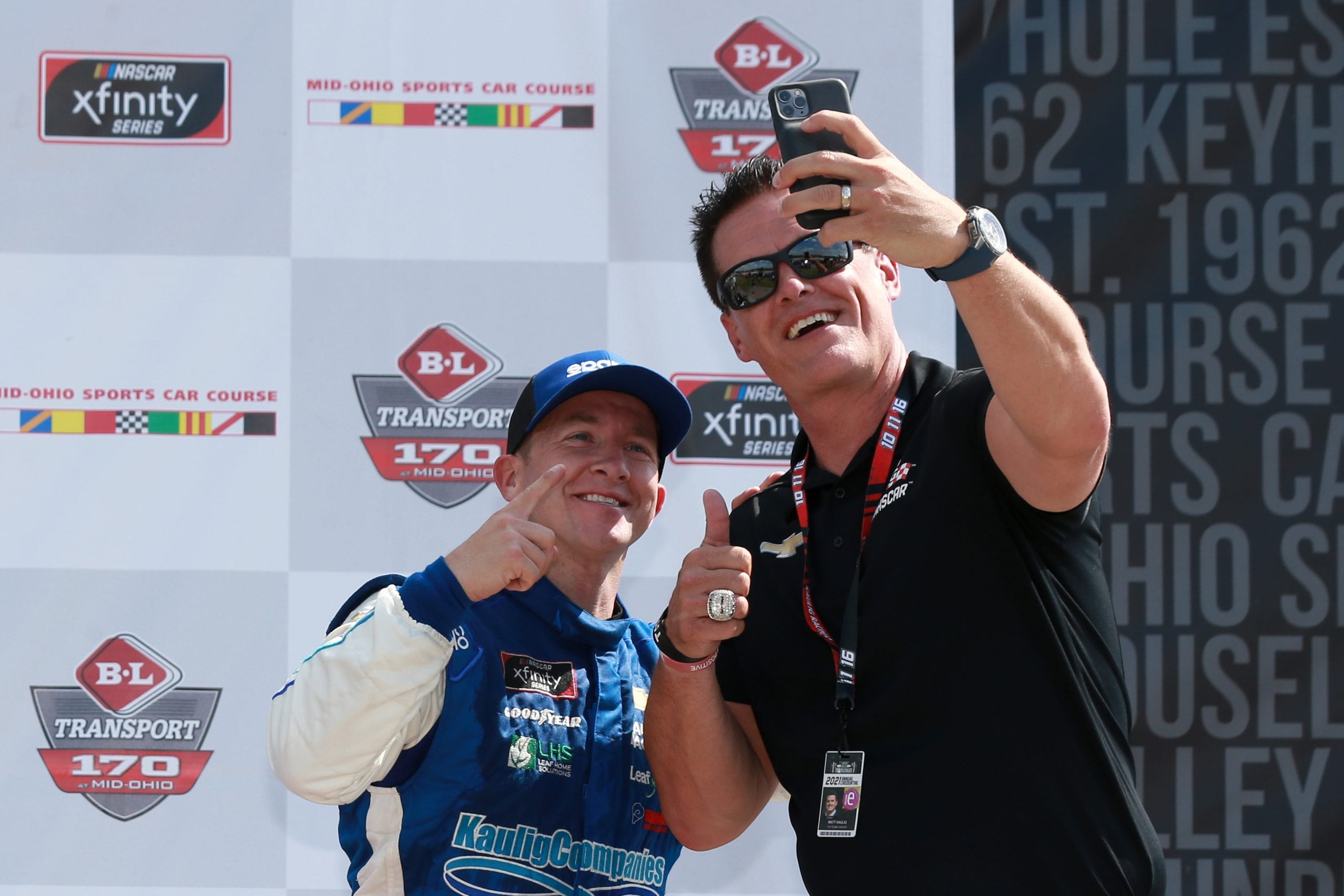 LEXINGTON, OHIO - JUNE 05: Team owner Matt Kaulig and AJ Allmendinger, driver of the #16 RAMCO Specialties Inc Chevrolet, pose for a selfie in victory lane after winning the NASCAR Xfinity Series B&L Transport 170 at Mid-Ohio Sports Car Course on June 05, 2021 in Lexington, Ohio. (Photo by Sean Gardner/Getty Images) | Getty Images