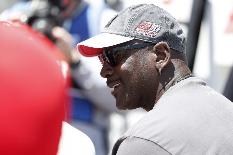 SONOMA, CALIFORNIA - JUNE 06: NBA Hall of Famer Michael Jordan and co-owner of 23XI Racing waits in the #23 DoorDash Toyota pit area prior to the NASCAR Cup Series Toyota/Save Mart 350 at Sonoma Raceway on June 06, 2021 in Sonoma, California. (Photo by Maddie Meyer/Getty Images) | Getty Images