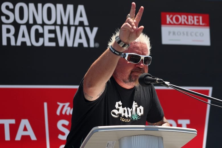 SONOMA, CALIFORNIA - JUNE 06: Honorary pace car driver, chef Guy Fieri speaks to the fans prior to the NASCAR Cup Series Toyota/Save Mart 350 at Sonoma Raceway on June 06, 2021 in Sonoma, California. (Photo by Carmen Mandato/Getty Images) | Getty Images