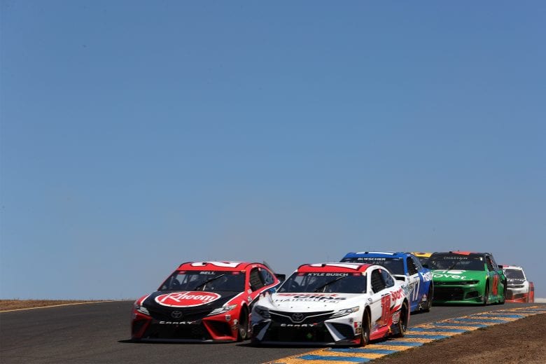 SONOMA, CALIFORNIA - JUNE 06: Kyle Busch, driver of the #18 Sport Clips Toyota, and Christopher Bell, driver of the #20 Rheem/Smurfit Kappa Toyota, race during the NASCAR Cup Series Toyota/Save Mart 350 at Sonoma Raceway on June 06, 2021 in Sonoma, California. (Photo by Carmen Mandato/Getty Images) | Getty Images