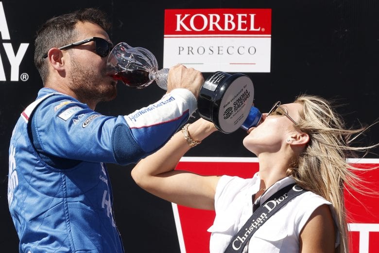 SONOMA, CALIFORNIA - JUNE 06: Kyle Larson, driver of the #5 HendrickCars.com Chevrolet, and wife, Katelyn celebrate in victory lane after winning the NASCAR Cup Series Toyota/Save Mart 350 at Sonoma Raceway on June 06, 2021 in Sonoma, California. (Photo by Maddie Meyer/Getty Images) | Getty Images