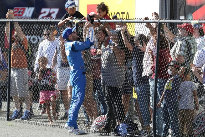 SONOMA, CALIFORNIA - JUNE 06: Kyle Larson, driver of the #5 HendrickCars.com Chevrolet, celebrates with fans after winning the NASCAR Cup Series Toyota/Save Mart 350 at Sonoma Raceway on June 06, 2021 in Sonoma, California. (Photo by Maddie Meyer/Getty Images) | Getty Images