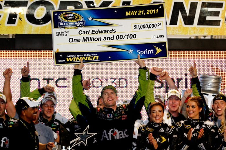 CHARLOTTE, NC - MAY 21:  Carl Edwards, driver of the #99 Aflac Ford, celebrates in victory lane after winning the NASCAR Sprint All-Star Race at Charlotte Motor Speedway on May 21, 2011 in Charlotte, North Carolina.  (Photo by Chris Graythen/Getty Images) | Getty Images