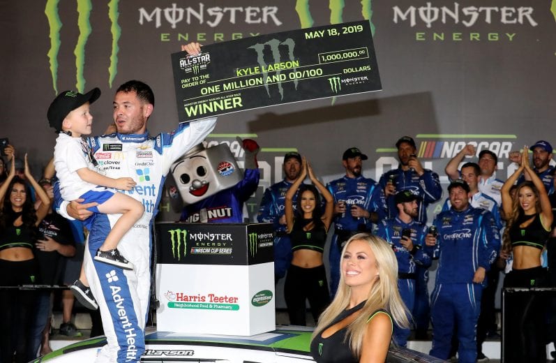 CHARLOTTE, NORTH CAROLINA - MAY 18: Kyle Larson, driver of the #42 Advent Health Chevrolet, celebrates with his son Owen in Victory Lane after winning the Monster Energy NASCAR Cup Series All-Star Race at Charlotte Motor Speedway on May 18, 2019 in Charlotte, North Carolina. (Photo by Streeter Lecka/Getty Images) | Getty Images