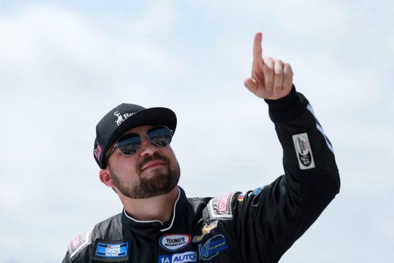 FORT WORTH, TEXAS - JUNE 12: Spencer Boyd, driver of the #20 Record Rack Chevrolet,points to fans during pre-race ceremonies prior to the NASCAR Camping World Truck Series SpeedyCash.com 220 at Texas Motor Speedway on June 12, 2021 in Fort Worth, Texas. (Photo by Sean Gardner/Getty Images) | Getty Images