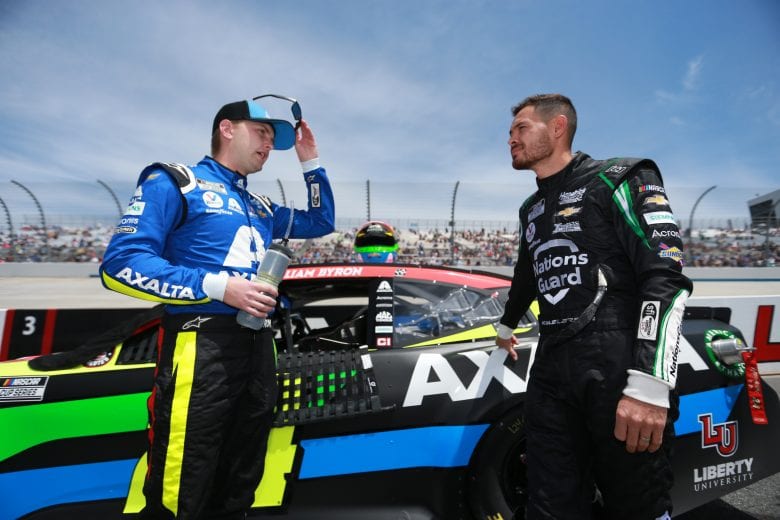 DOVER, DELAWARE - MAY 16: William Byron, driver of the #24 Axalta Chevrolet, and Kyle Larson, driver of the #5 NationsGuard Chevrolet, talk on the grid during the NASCAR Cup Series Drydene 400 at Dover International Speedway on May 16, 2021 in Dover, Delaware. (Photo by Sean Gardner/Getty Images) | Getty Images