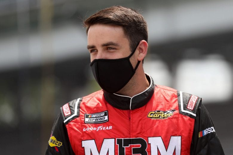 INDIANAPOLIS, INDIANA - JULY 04:  Timmy Hill, driver of the #13 ROOFCLAIM.COM Toyota,stands on the grid during the NASCAR Xfinity Series Pennzoil 150 at the Brickyard at Indianapolis Motor Speedway on July 04, 2020 in Indianapolis, Indiana. (Photo by Chris Graythen/Getty Images) | Getty Images