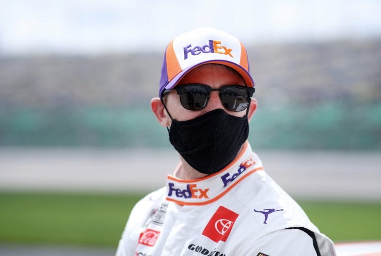 KANSAS CITY, KANSAS - MAY 02: Denny Hamlin, driver of the #11 FedEx Freight Toyota, waits on the grid prior to the NASCAR Cup Series Buschy McBusch Race 400 at Kansas Speedway on May 02, 2021 in Kansas City, Kansas. (Photo by Sean Gardner/Getty Images) | Getty Images