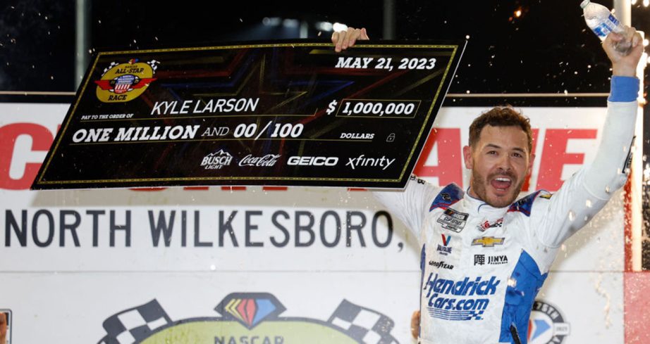 Kyle Larson celebrates in Victory Lane