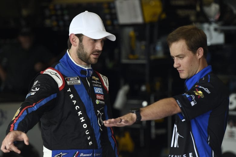 LEBANON, TENNESSEE - JUNE 19: Daniel Suarez, driver of the #99 Tootsies Orchid Lounge Chevrolet, and crew member talk in the garage area during practice for the NASCAR Cup Series Ally 400 at Nashville Superspeedway on June 19, 2021 in Lebanon, Tennessee. (Photo by Logan Riely/Getty Images) | Getty Images