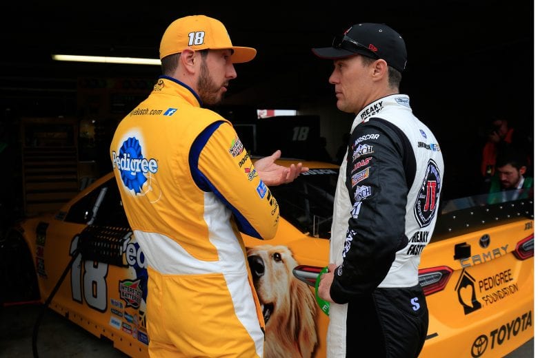DOVER, DE - MAY 04: Kyle Busch, driver of the #18 Pedigree Toyota, talks with Kevin Harvick, driver of the #4 Jimmy John's Ford, during practice for the Monster Energy NASCAR Cup Series Gander RV 400 at Dover International Speedway on May 4, 2019 in Dover, Delaware. (Photo by Chris Trotman/Getty Images) | Getty Images