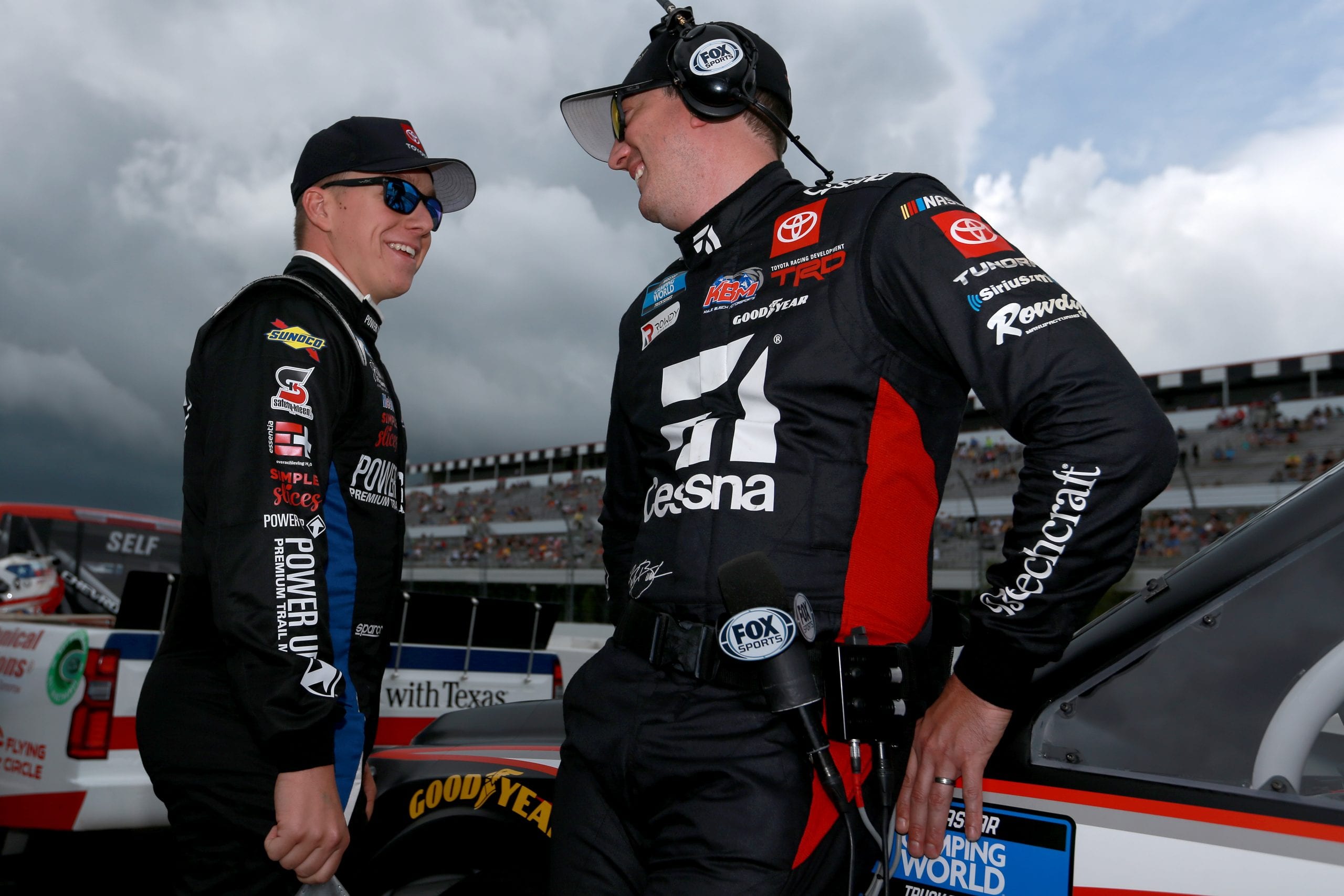 LONG POND, PENNSYLVANIA - JUNE 26: John Hunter Nemechek, driver of the #4 Power Up Premium Trail Mix Toyota, (L) and Kyle Busch, driver of the #51 Cessna Toyota, talk on the grid prior to the NASCAR Camping World Truck Series CRC Brakleen 150 at Pocono Raceway on June 26, 2021 in Long Pond, Pennsylvania. (Photo by Sean Gardner/Getty Images) | Getty Images