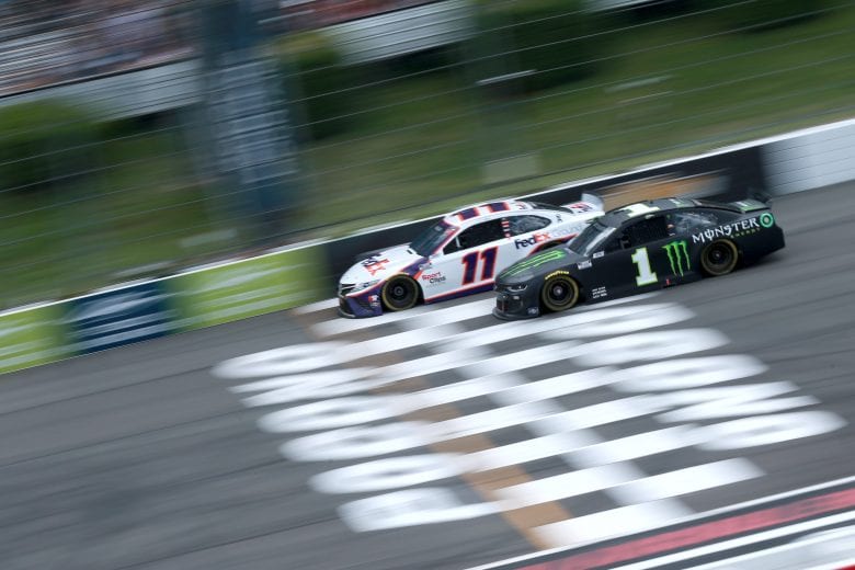 LONG POND, PENNSYLVANIA - JUNE 26: Denny Hamlin, driver of the #11 FedEx Ground Toyota, and Kurt Busch, driver of the #1 Monster Energy Chevrolet, race during the NASCAR Cup Series Pocono Organics CBD 325 at Pocono Raceway on June 26, 2021 in Long Pond, Pennsylvania. (Photo by Sean Gardner/Getty Images) | Getty Images